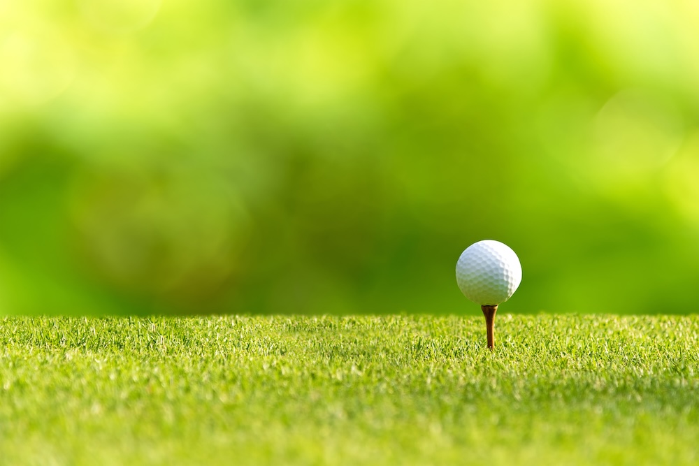 Closeup of a golf ball on a tee