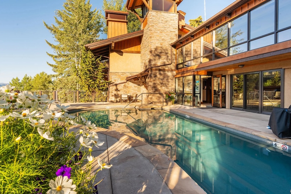 Condominium complex community pool and outdoor dining area